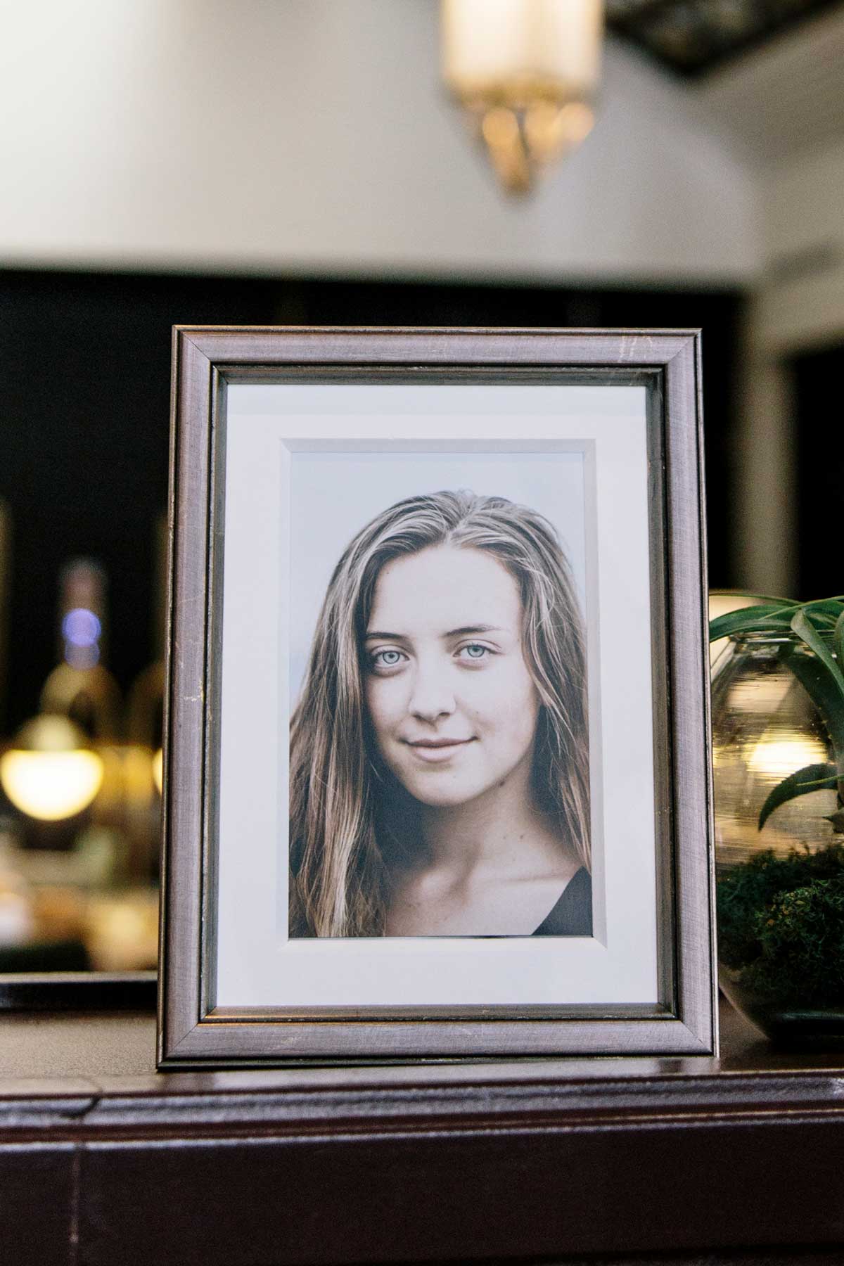 Styled Brancui Piombo 5x7 pewter-colored frame on a wooden surface with beautiful ambience and golden decor