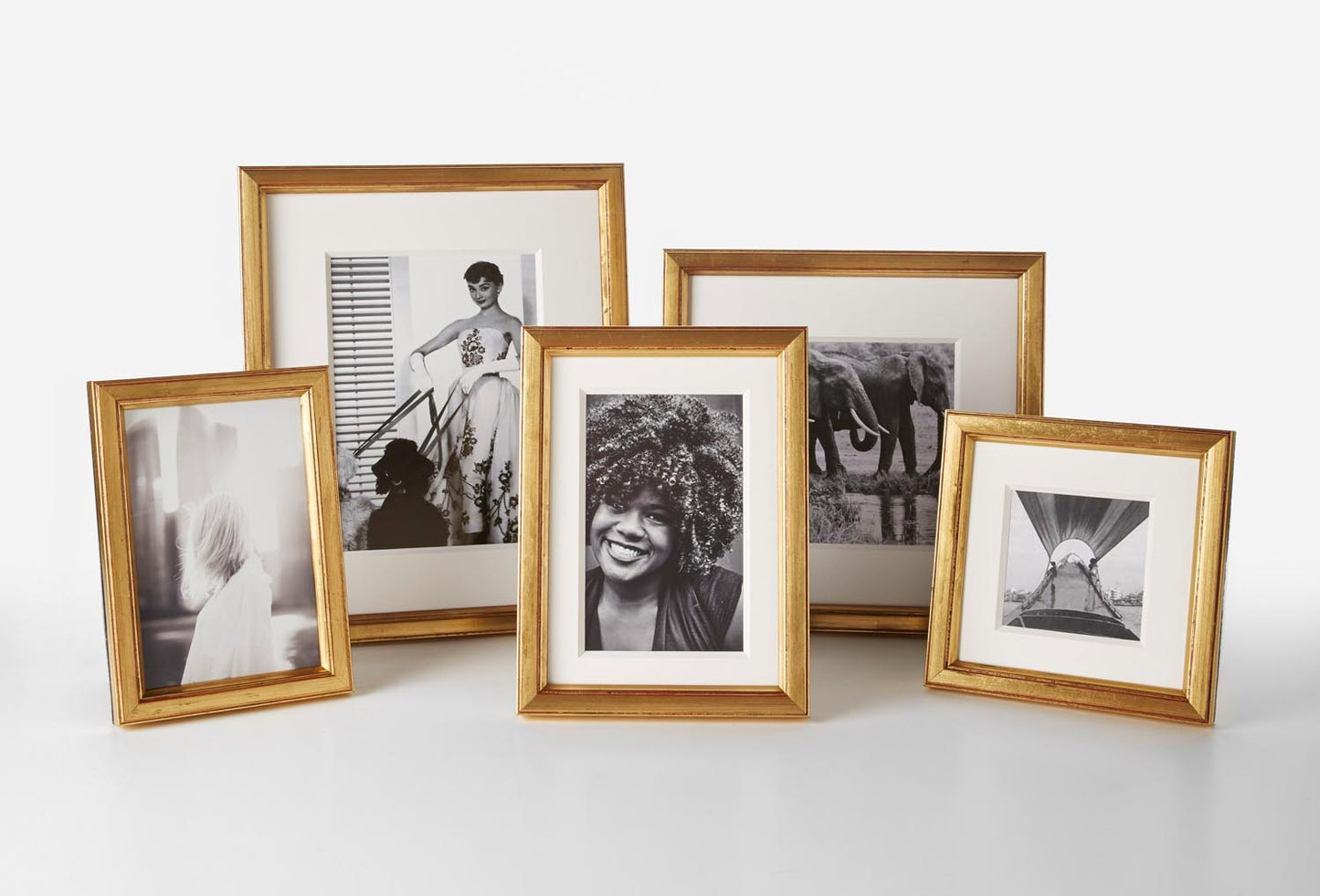 Range of sizes of Gold Brancusi Oro Frames in gold, with beautiful black and white photos inside