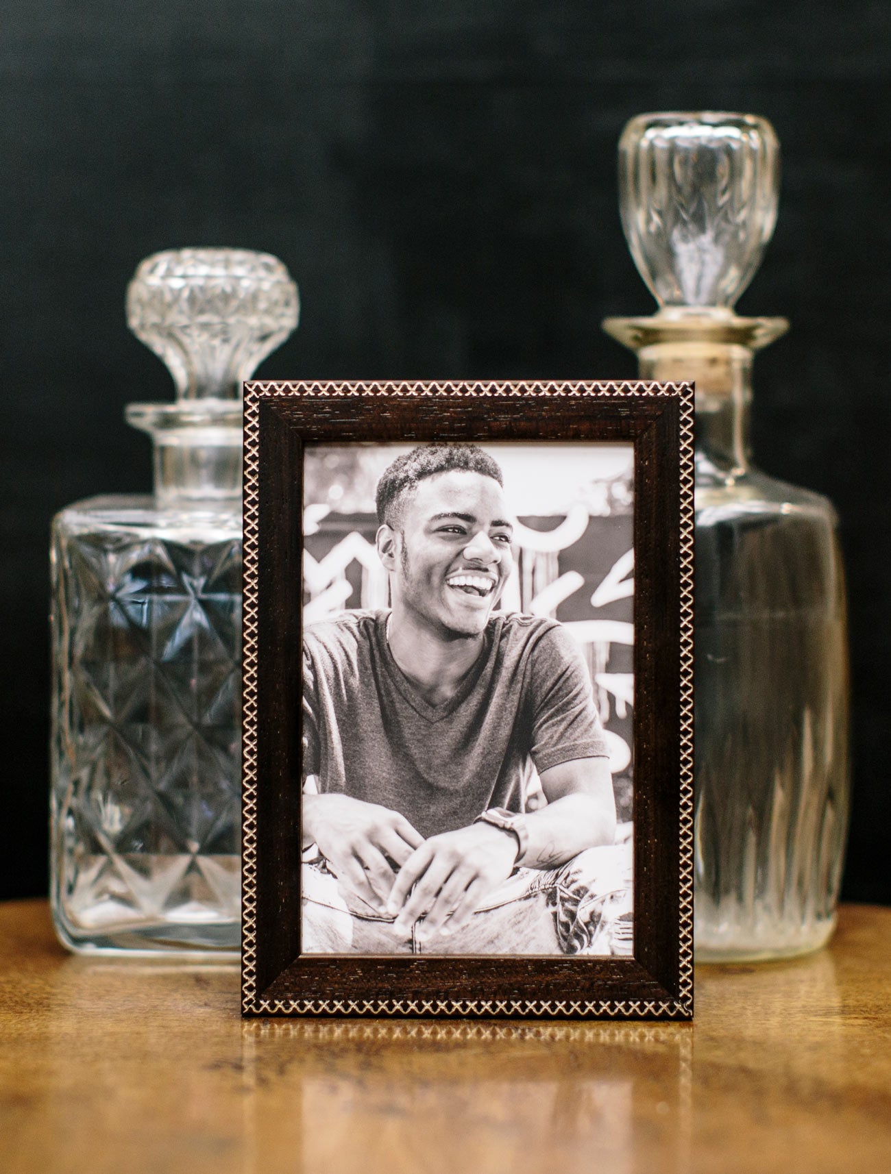 Jax Brown 5x7 frame with Gold criss-cross detailing styled with crystal decanters on a tabletop