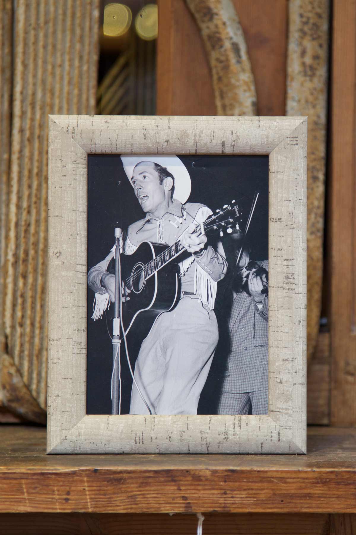 Tappo Dove Gray Cork Frame, on a countertop, with a cowboy framed inside